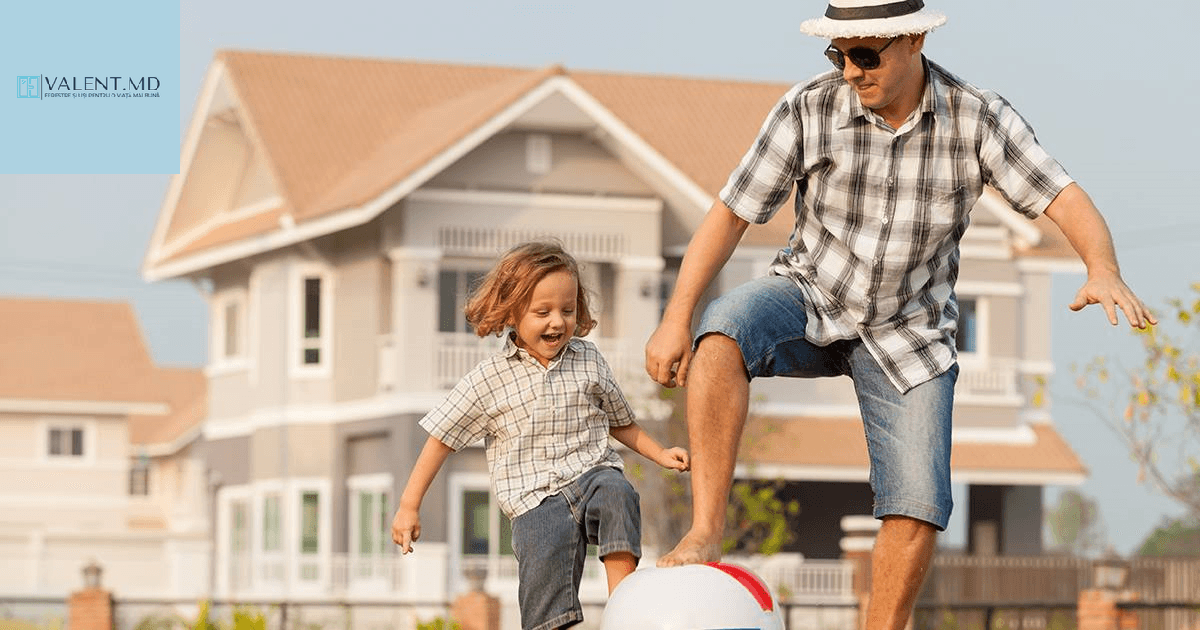 Happy family in front of a house with PVC windows
